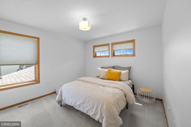 2119 13th Ave E, North Saint Paul, MN 55109 - carpeted bedroom featuring baseboards