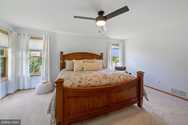 2119 13th Ave E, North Saint Paul, MN 55109 - bedroom with light carpet and ceiling fan