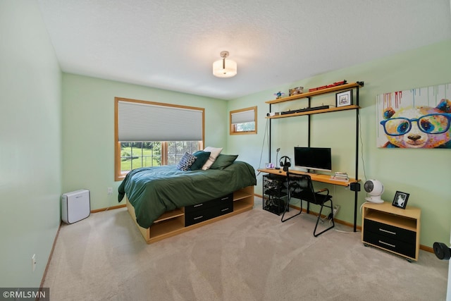 2119 13th Ave E, North Saint Paul, MN 55109 - carpeted bedroom with a desk and baseboards