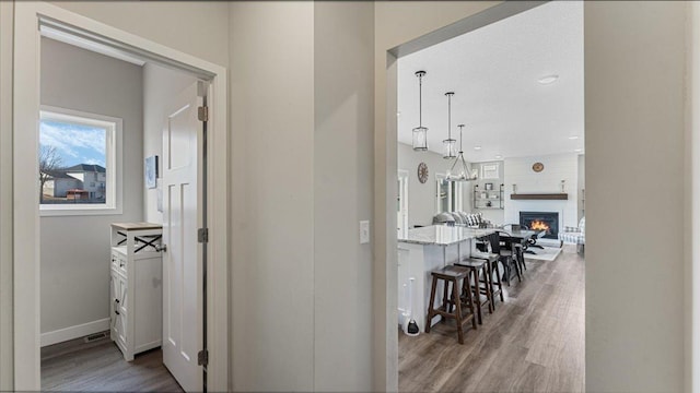 1715 Par Ln, Buffalo, MN 55313 - hall featuring wood finished floors, a chandelier, baseboards, and recessed lighting