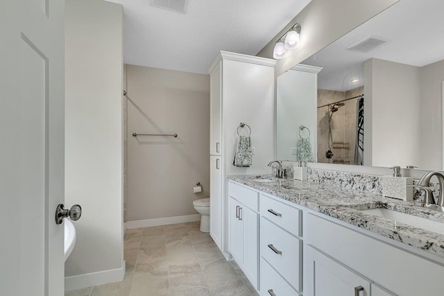 1715 Par Ln, Buffalo, MN 55313 - bathroom featuring baseboards, tiled shower, toilet, and double vanity