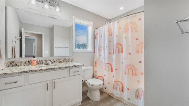 1715 Par Ln, Buffalo, MN 55313 - full bath with toilet, wood finished floors, vanity, and a shower with shower curtain