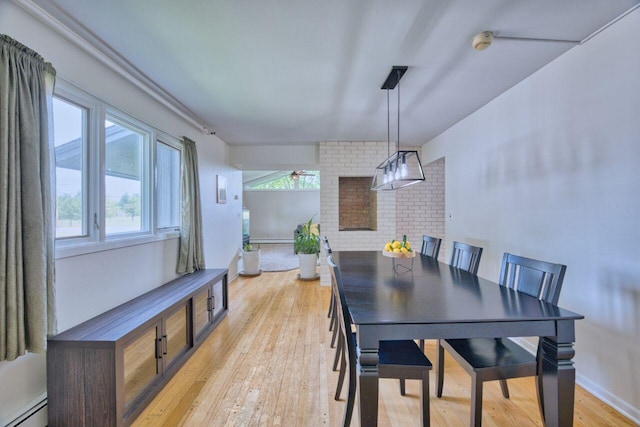 417 Main St S, Aurora, MN 55705 - dining room featuring a baseboard radiator and light wood-style floors