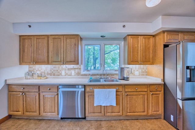 417 Main St S, Aurora, MN 55705 - kitchen with appliances with stainless steel finishes, brown cabinetry, and decorative backsplash