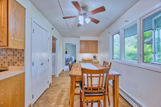 417 Main St S, Aurora, MN 55705 - dining space with baseboard heating and a ceiling fan