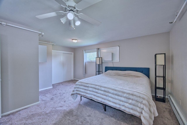 417 Main St S, Aurora, MN 55705 - carpeted bedroom with baseboard heating, a closet, and a ceiling fan