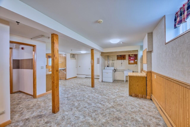 417 Main St S, Aurora, MN 55705 - kitchen with washer / dryer, carpet flooring, a baseboard heating unit, a baseboard radiator, and a wainscoted wall
