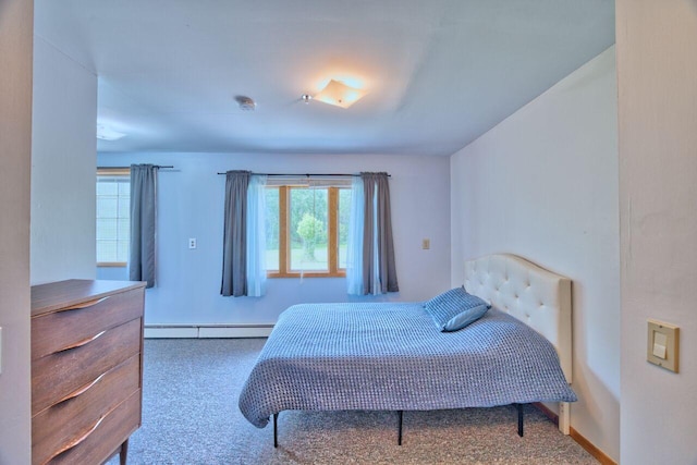 417 Main St S, Aurora, MN 55705 - bedroom featuring a baseboard heating unit and carpet floors