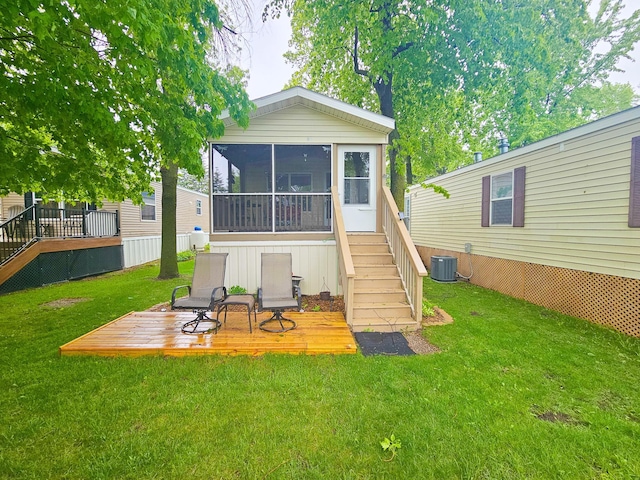 2600 Big Horn Bay Rd NW Unit 38, Alexandria, MN 56308 - back of house featuring stairway, a sunroom, a wooden deck, a lawn, and cooling unit
