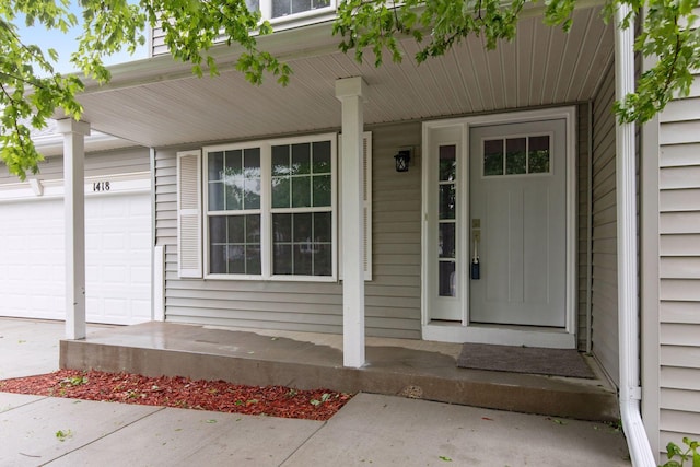1418 Bluff St, Dundas, MN 55019 - entrance to property featuring a garage and covered porch