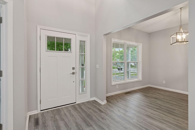 1418 Bluff St, Dundas, MN 55019 - foyer entrance featuring wood finished floors and baseboards