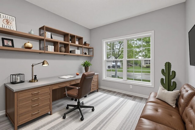 1418 Bluff St, Dundas, MN 55019 - home office with built in desk and light wood-style floors
