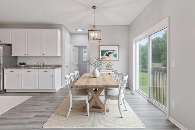 1418 Bluff St, Dundas, MN 55019 - dining space with a chandelier and wood finished floors