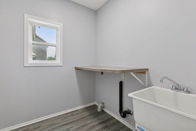 1418 Bluff St, Dundas, MN 55019 - laundry area featuring wood finished floors and baseboards