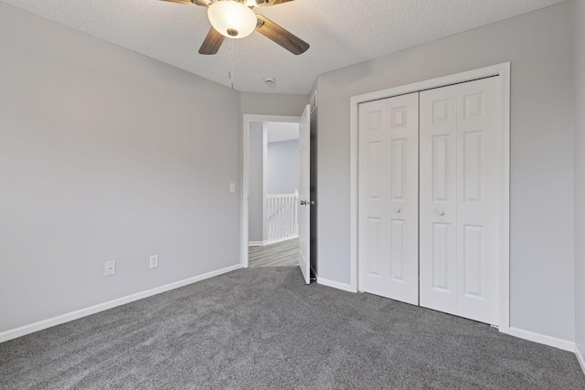 1418 Bluff St, Dundas, MN 55019 - unfurnished bedroom with dark colored carpet, a textured ceiling, a closet, and a ceiling fan