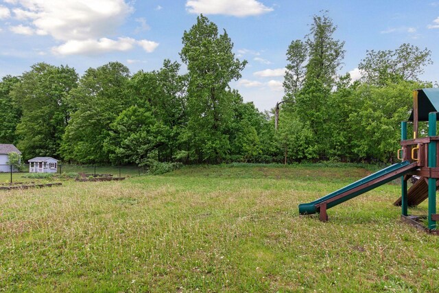 1418 Bluff St, Dundas, MN 55019 - view of yard featuring a playground and an outbuilding
