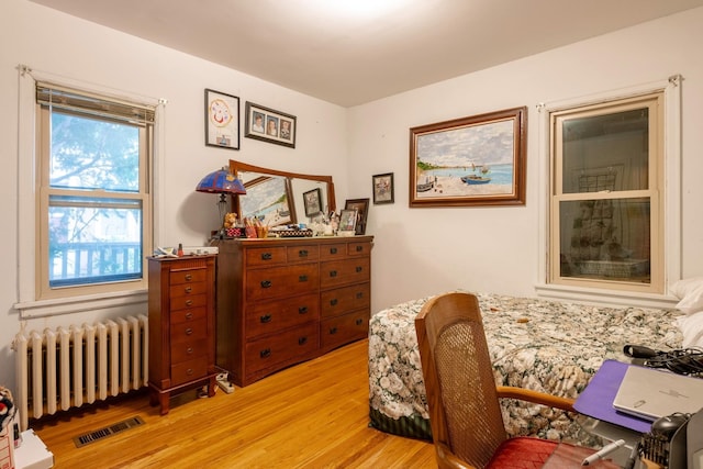 241 Queen Ave S, Minneapolis, MN 55405 - sitting room with radiator heating unit and light wood finished floors