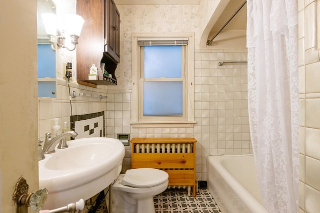 241 Queen Ave S, Minneapolis, MN 55405 - bathroom featuring tile walls, a sink, toilet, radiator heating unit, and shower / tub combo with curtain