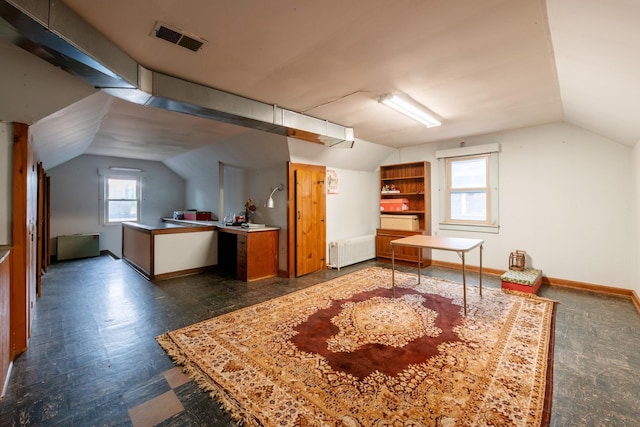 241 Queen Ave S, Minneapolis, MN 55405 - additional living space featuring lofted ceiling, radiator heating unit, and baseboards