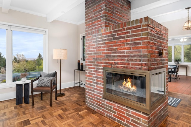 1101 Skyline Pkwy, Duluth, MN 55805 - living area featuring baseboards, a brick fireplace, beamed ceiling, and ornamental molding