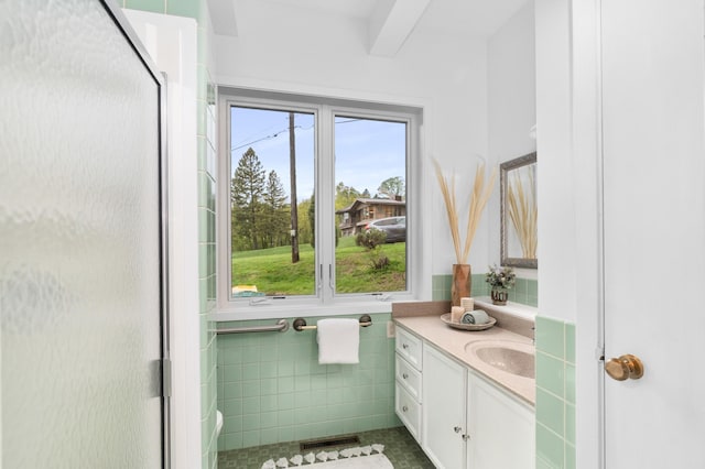 1101 Skyline Pkwy, Duluth, MN 55805 - bathroom with tile walls, vanity, a shower stall, tile patterned floors, and beam ceiling