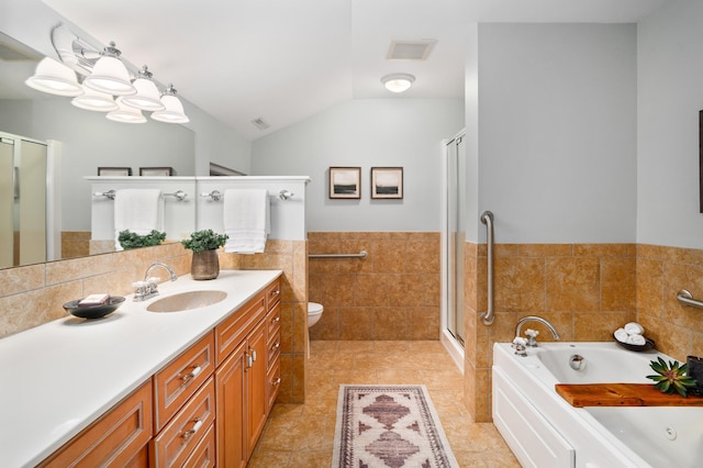 1101 Skyline Pkwy, Duluth, MN 55805 - bathroom with tile walls, a stall shower, vanity, a whirlpool tub, and vaulted ceiling