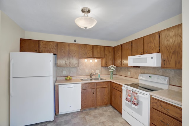 26 10th St W Unit 502, Saint Paul, MN 55102 - kitchen with white appliances, brown cabinetry, light countertops, and decorative backsplash