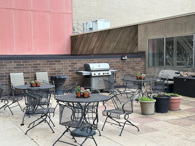 26 10th St W Unit 502, Saint Paul, MN 55102 - view of patio featuring a grill and outdoor dining area