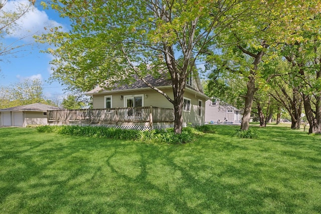 381 Ormsbee St, Big Lake, MN 55309 - rear view of property featuring a wooden deck, a yard, and a garage