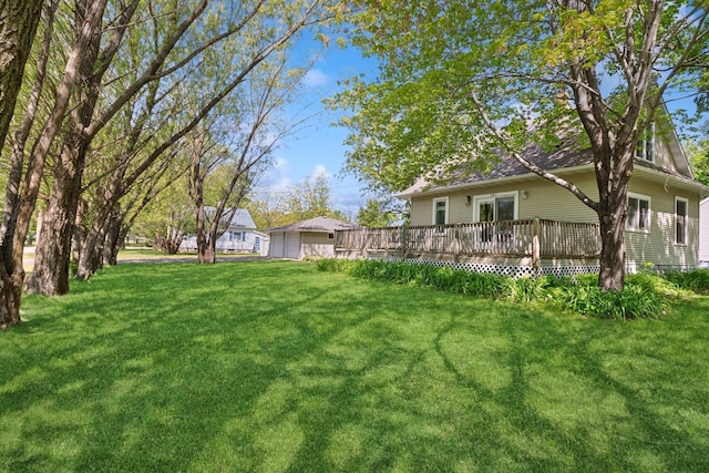 381 Ormsbee St, Big Lake, MN 55309 - view of green lawn with a deck and a garage