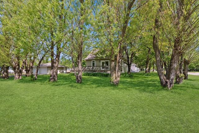 381 Ormsbee St, Big Lake, MN 55309 - view of green lawn featuring a deck