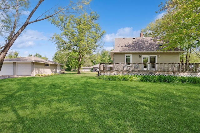 381 Ormsbee St, Big Lake, MN 55309 - view of green lawn featuring a wooden deck and a garage