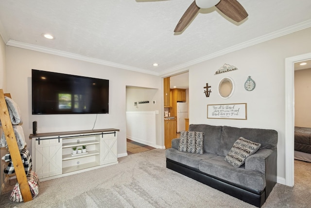 381 Ormsbee St, Big Lake, MN 55309 - carpeted living room with ceiling fan, recessed lighting, ornamental molding, and baseboards