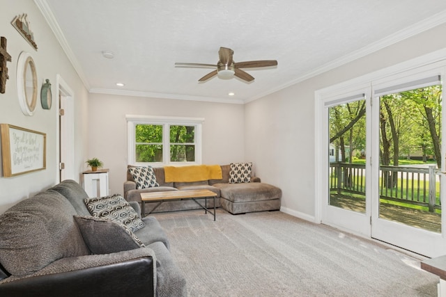 381 Ormsbee St, Big Lake, MN 55309 - carpeted living room with healthy amount of natural light, a ceiling fan, crown molding, recessed lighting, and baseboards