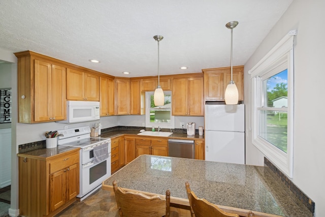381 Ormsbee St, Big Lake, MN 55309 - kitchen with white appliances, a sink, hanging light fixtures, a peninsula, and recessed lighting