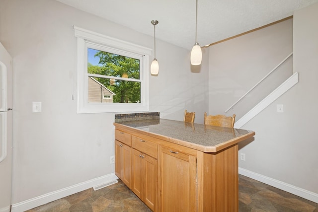 381 Ormsbee St, Big Lake, MN 55309 - kitchen featuring stone finish floors, baseboards, tile countertops, a peninsula, and hanging light fixtures