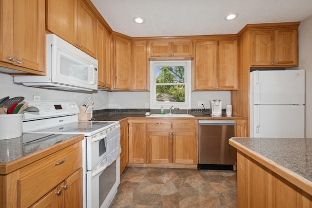 381 Ormsbee St, Big Lake, MN 55309 - kitchen with white appliances, a sink, stone finish flooring, recessed lighting, and brown cabinets