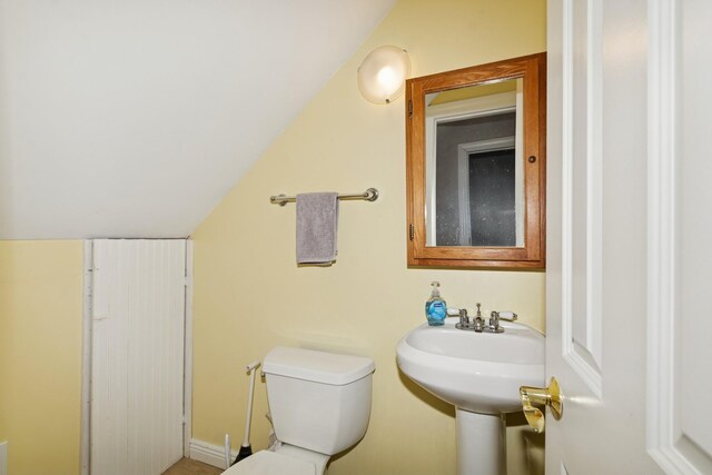 381 Ormsbee St, Big Lake, MN 55309 - bathroom featuring toilet and vaulted ceiling
