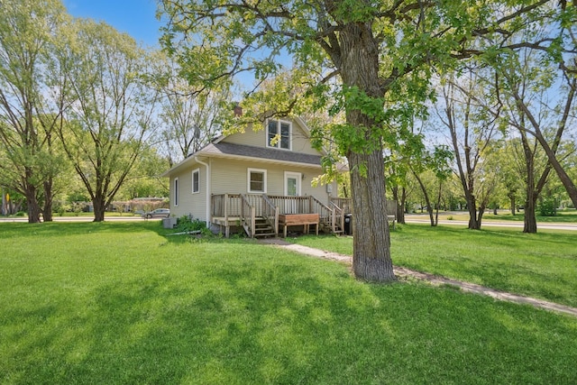 381 Ormsbee St, Big Lake, MN 55309 - rear view of house featuring a wooden deck and a yard
