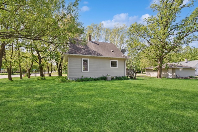 381 Ormsbee St, Big Lake, MN 55309 - rear view of property featuring a yard and a chimney