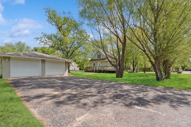 381 Ormsbee St, Big Lake, MN 55309 - view of front of home with an outdoor structure, a detached garage, and a front lawn