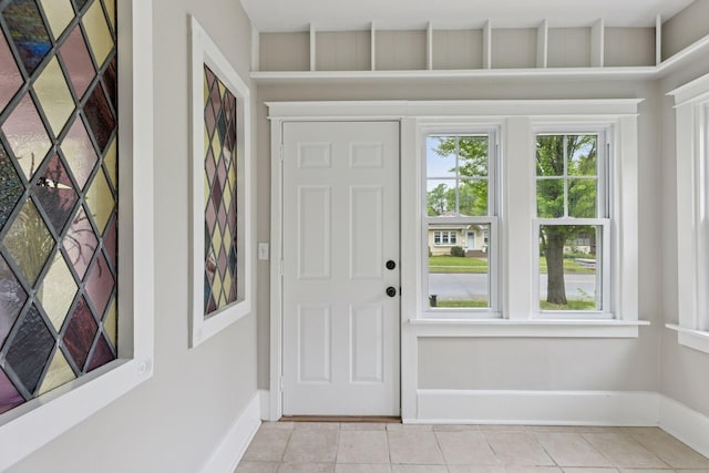 1418 Payne Ave, Saint Paul, MN 55130 - foyer featuring light tile patterned floors and baseboards