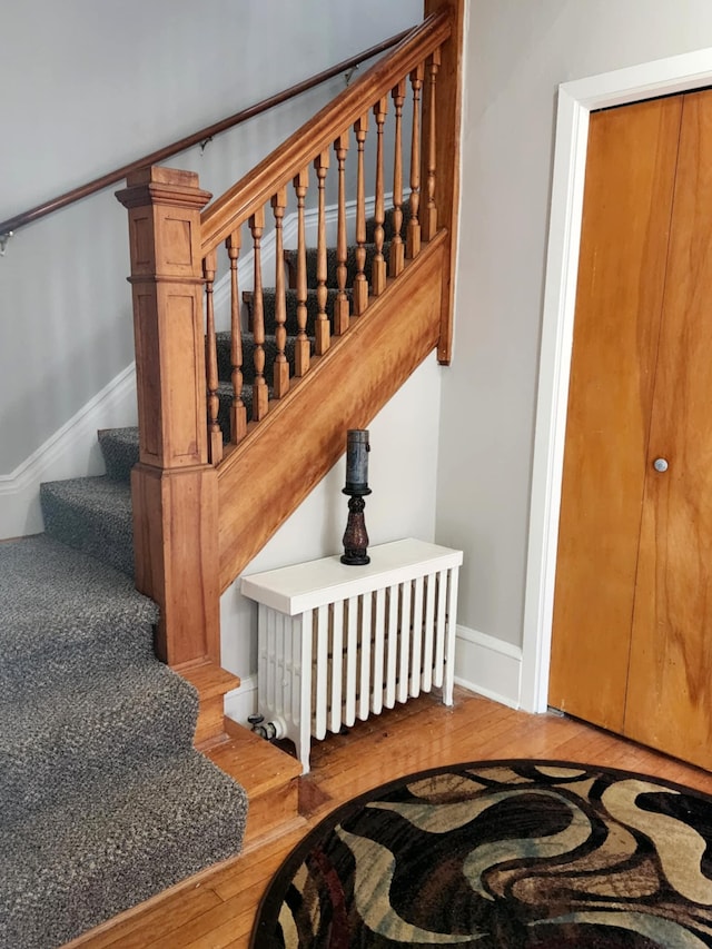 1418 Payne Ave, Saint Paul, MN 55130 - stairs featuring hardwood / wood-style flooring and baseboards