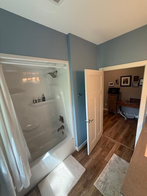 6207 Lagoon Dr NE, Bemidji, MN 56601 - bathroom with wood finished floors and shower / bath combo