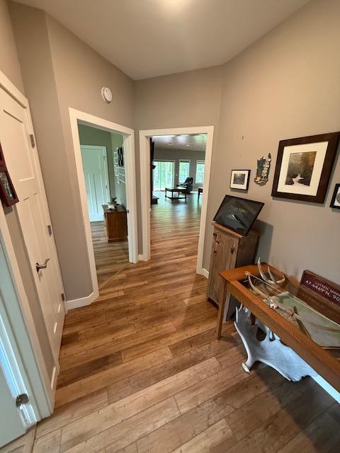 6207 Lagoon Dr NE, Bemidji, MN 56601 - hallway with light wood-type flooring and baseboards