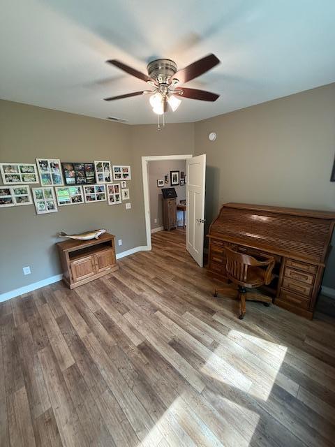 6207 Lagoon Dr NE, Bemidji, MN 56601 - office with a ceiling fan, wood finished floors, and baseboards