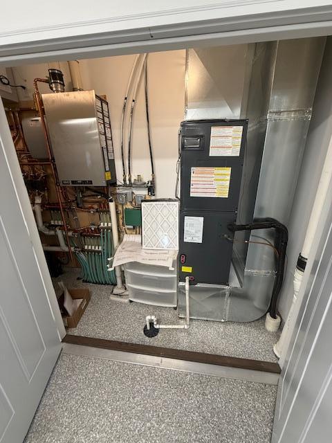 6207 Lagoon Dr NE, Bemidji, MN 56601 - utility room featuring water heater