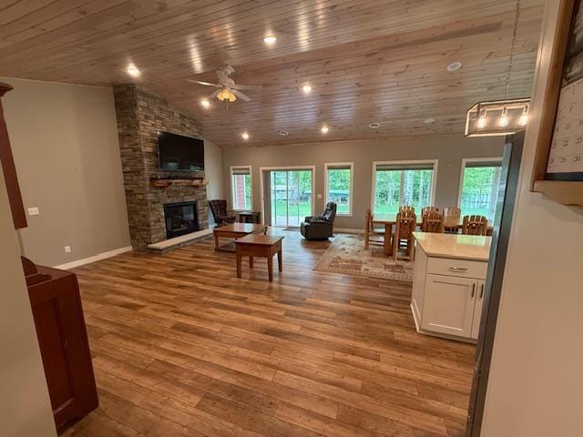 6207 Lagoon Dr NE, Bemidji, MN 56601 - living area with wooden ceiling, a ceiling fan, healthy amount of natural light, wood finished floors, and vaulted ceiling