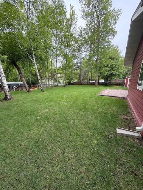 6207 Lagoon Dr NE, Bemidji, MN 56601 - view of yard featuring a wooden deck