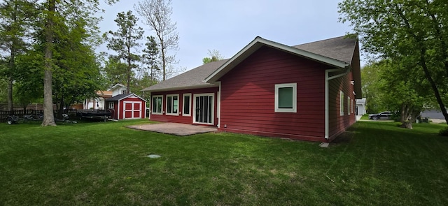6207 Lagoon Dr NE, Bemidji, MN 56601 - back of house with a yard and a patio